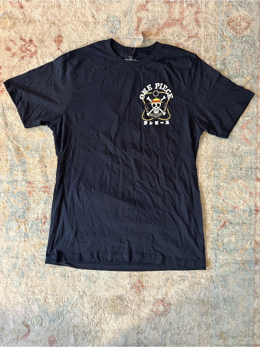 One Piece Black Tee with White & Yellow Skull Crest
